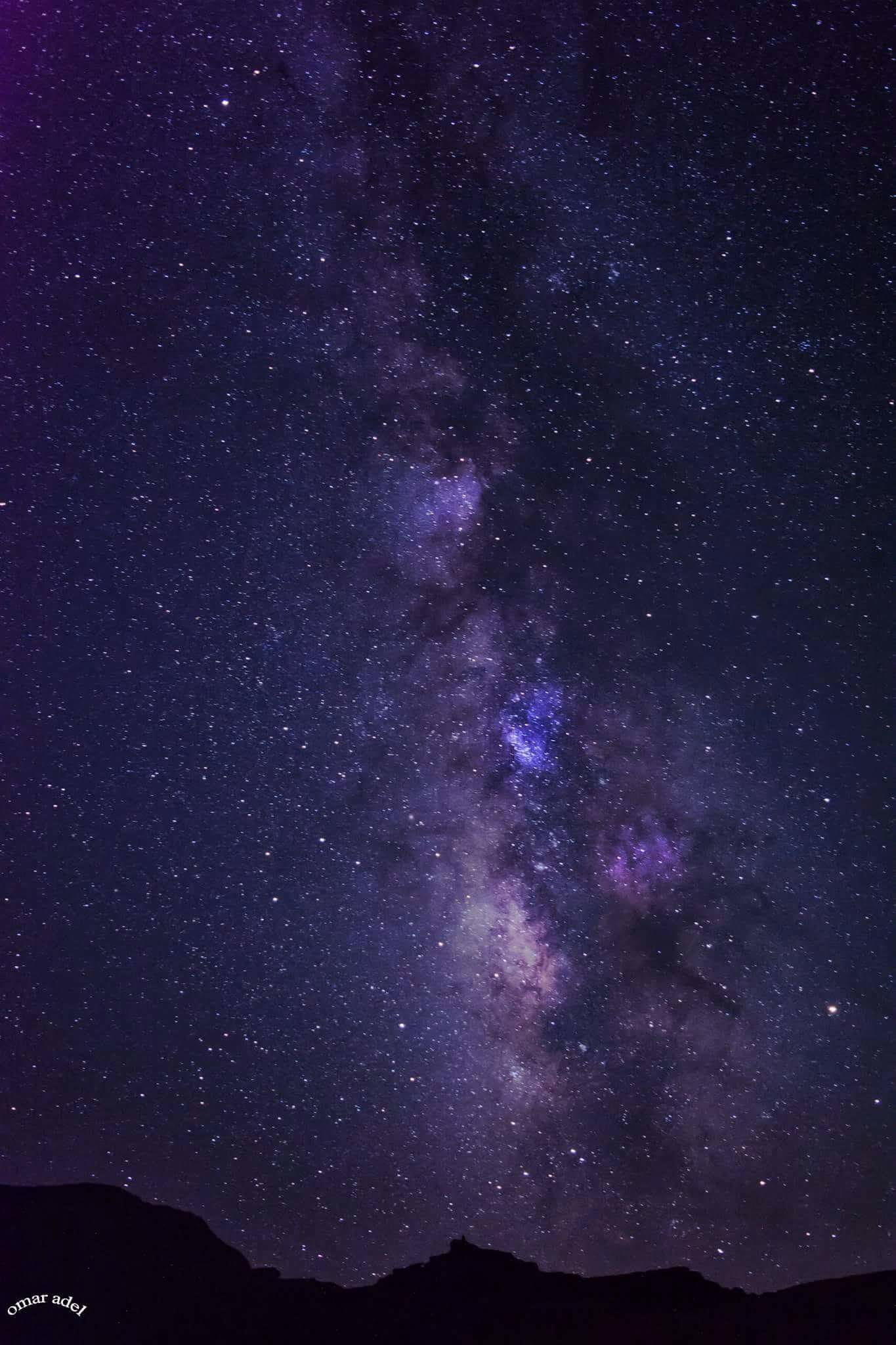 Milky Way visible above a dark Egyptian horizon