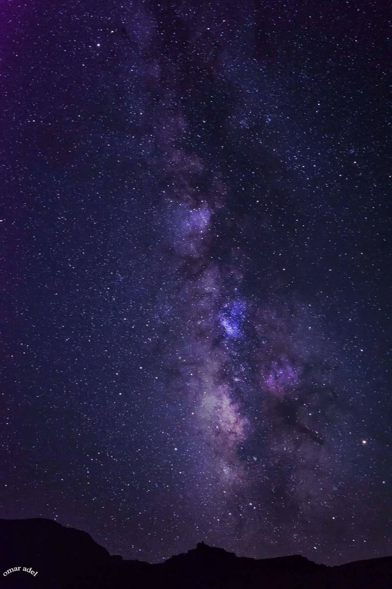 Milky Way arch above a dark Egyptian landscape